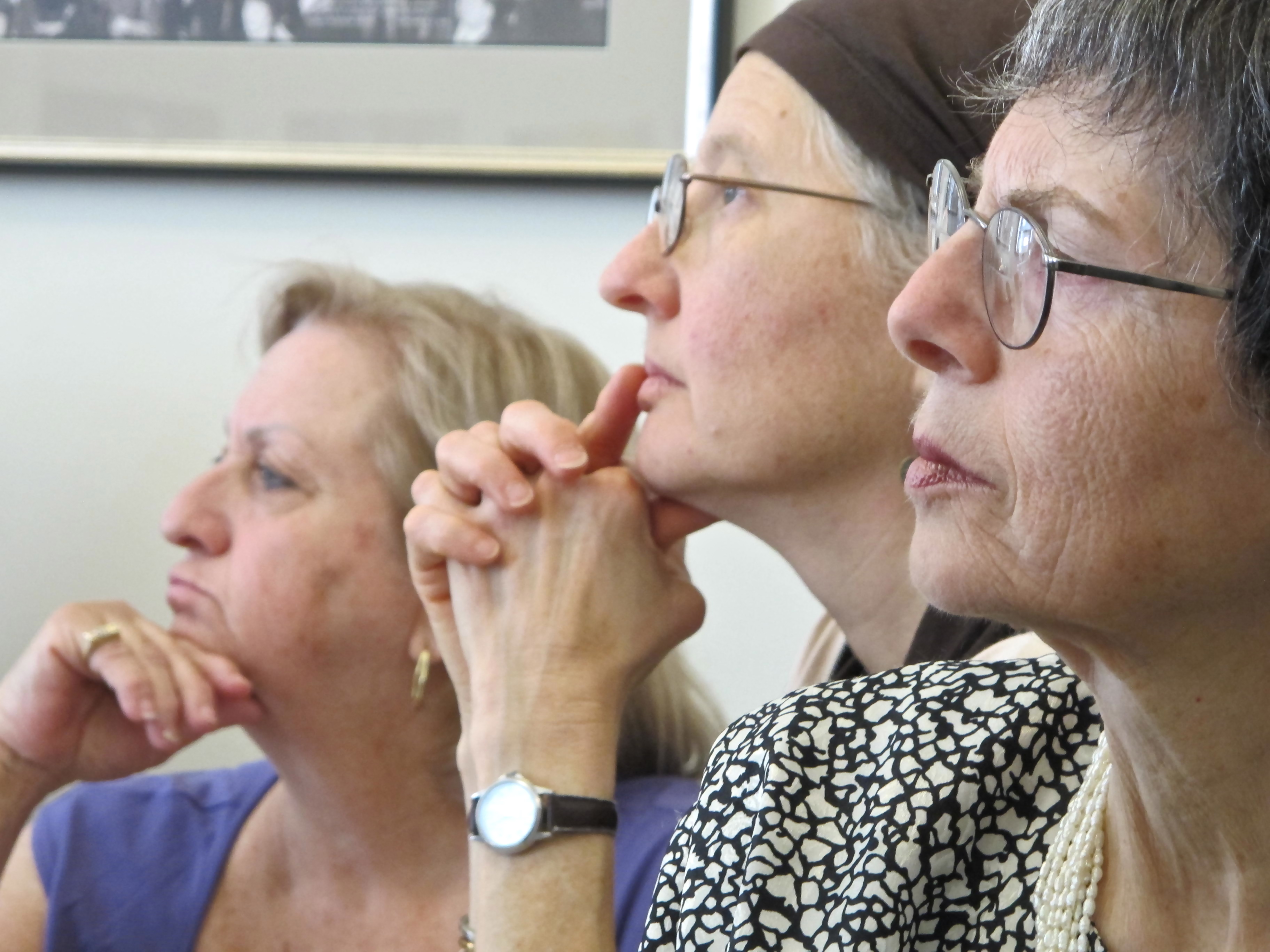 Three women lost in thought